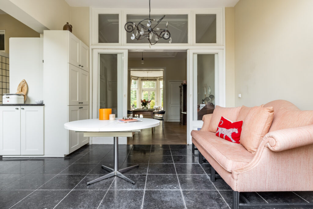 Cozy living room with sofa and round table.