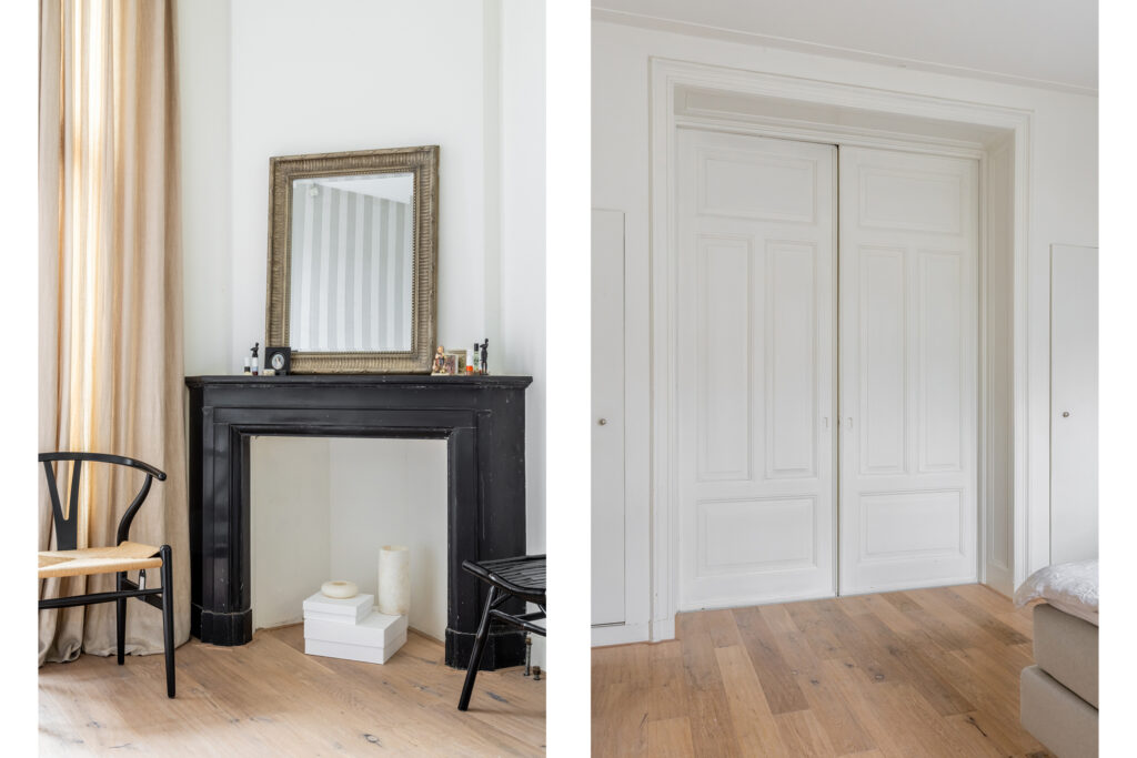 Elegant interior with black fireplace and white doors.
