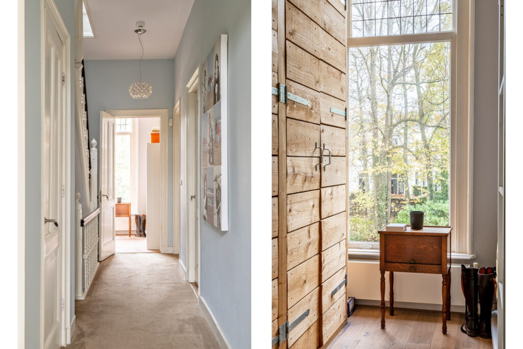 Bright hallway with large windows and wooden furniture.