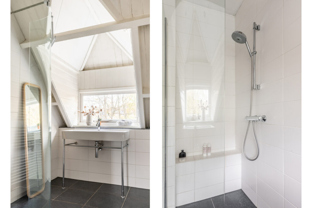 Minimalist attic bathroom with shower and sink