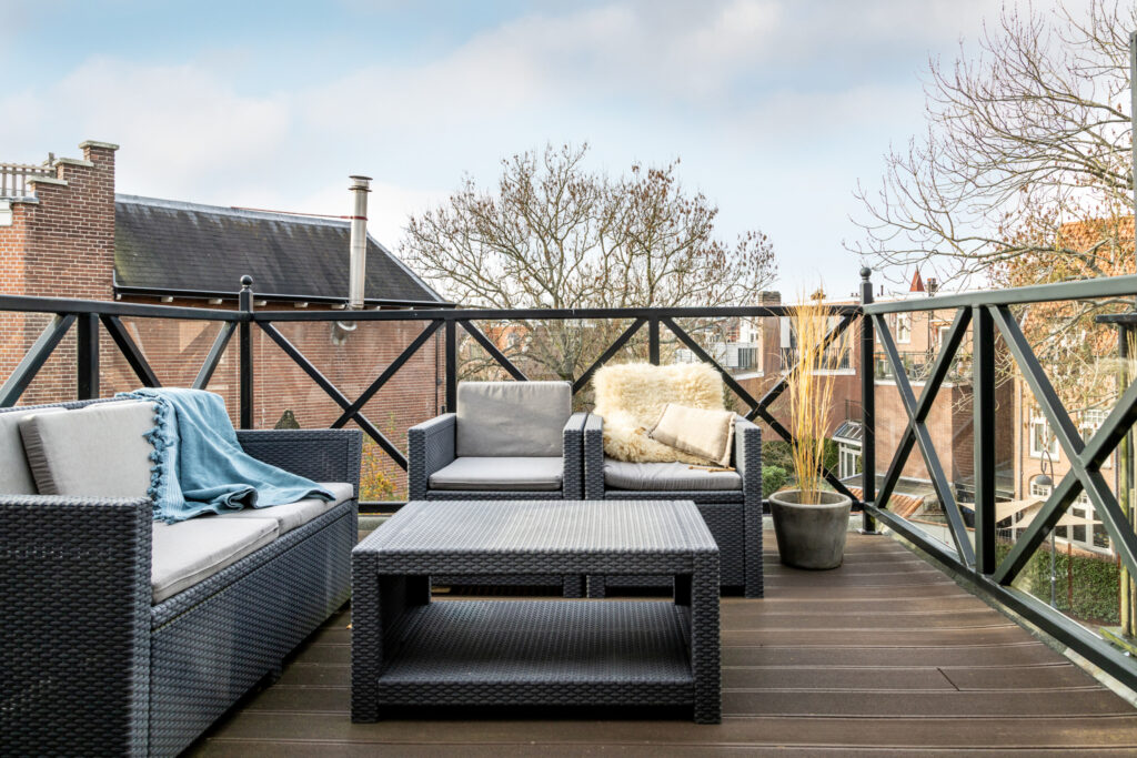 Cozy rooftop terrace with outdoor seating.