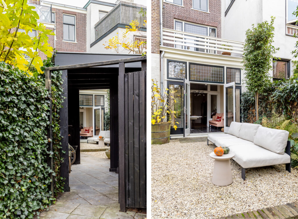 Modern backyard with patio seating and open doors.