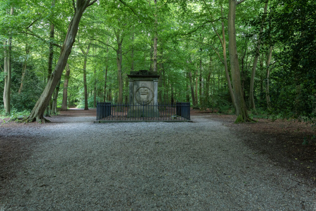 Stone monument in tranquil wooded area