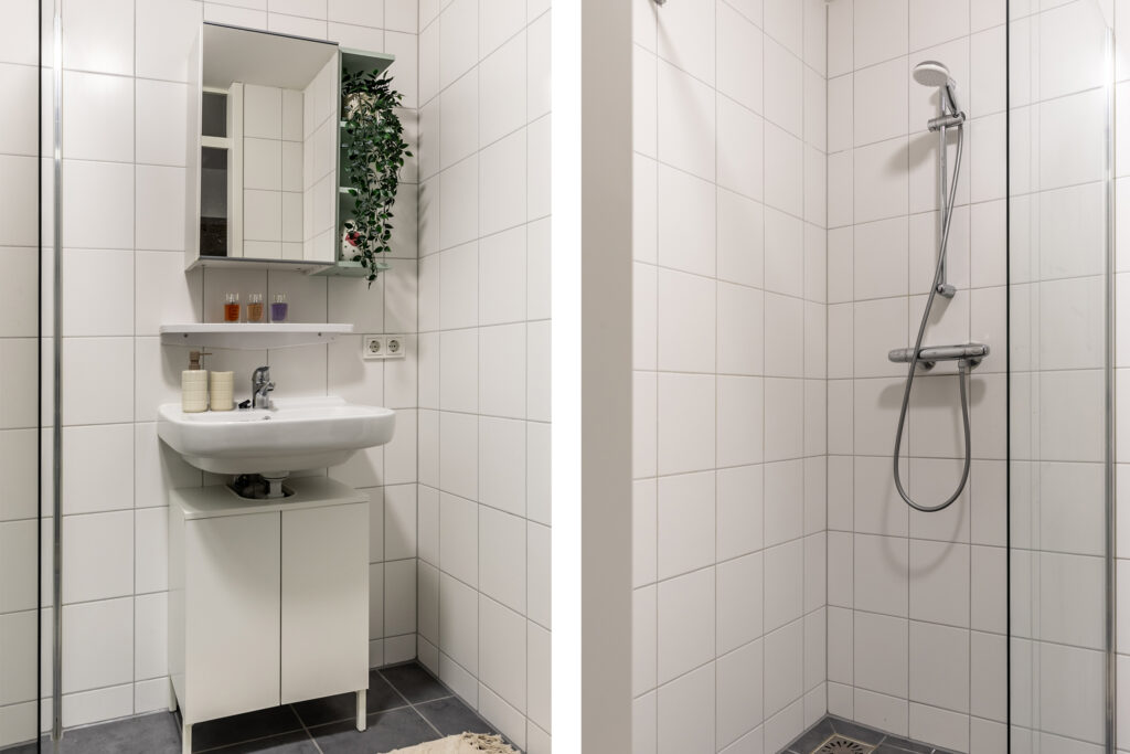 Modern bathroom with sink and shower.