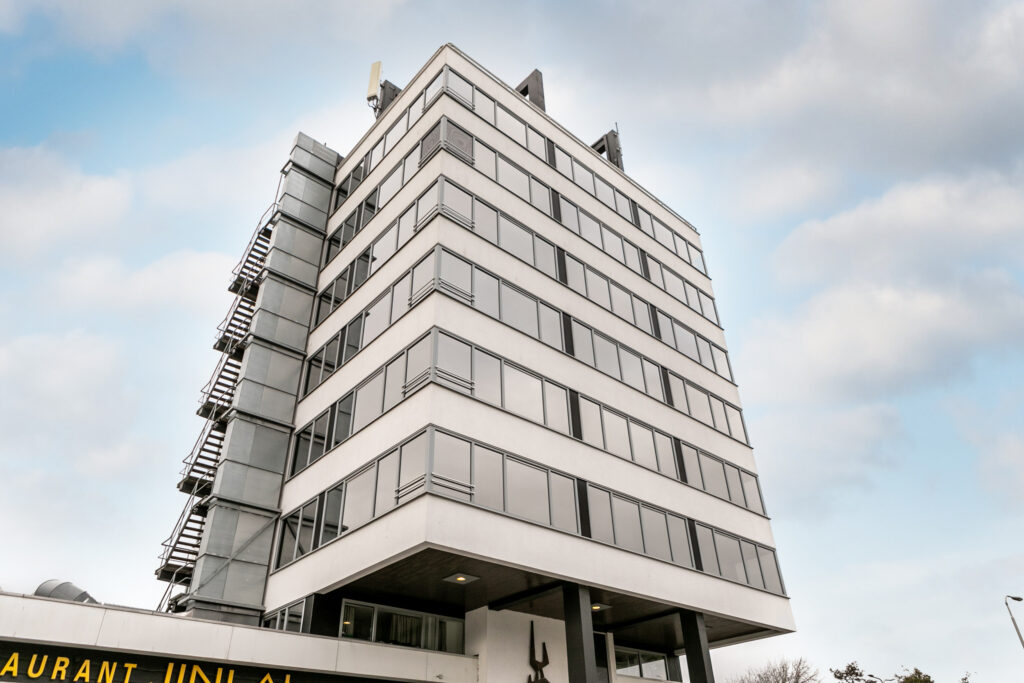 Modern office building with large windows exterior view.