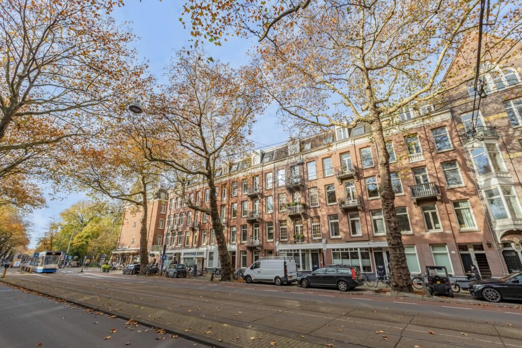 Autumn street with tram and brick buildings