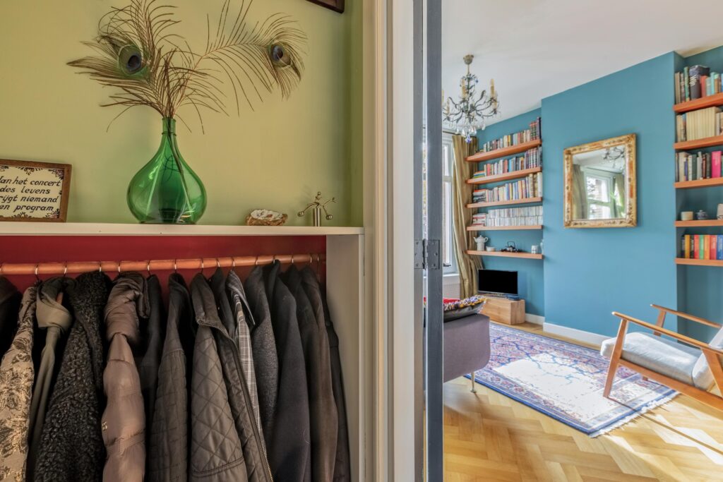 Cozy living room with bookshelves and coat closet