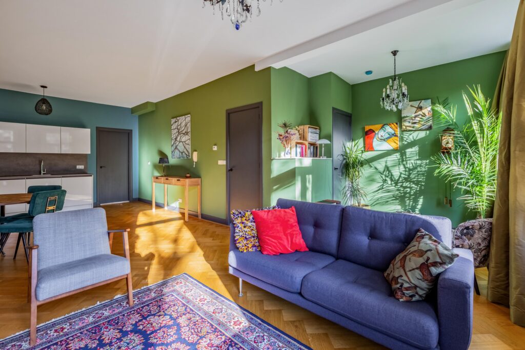 Colorful living room with modern green walls.