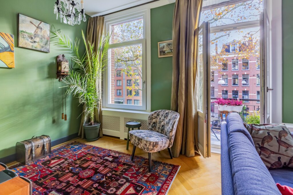 Cozy living room with open balcony view.