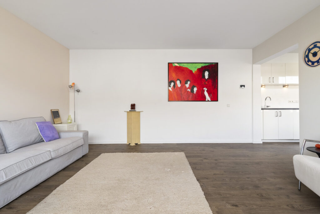 Spacious living room with abstract art.