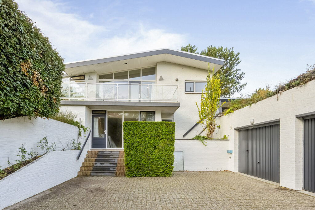 Modern two-story white house with garage