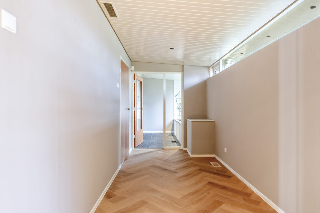 Minimalist hallway with wooden flooring