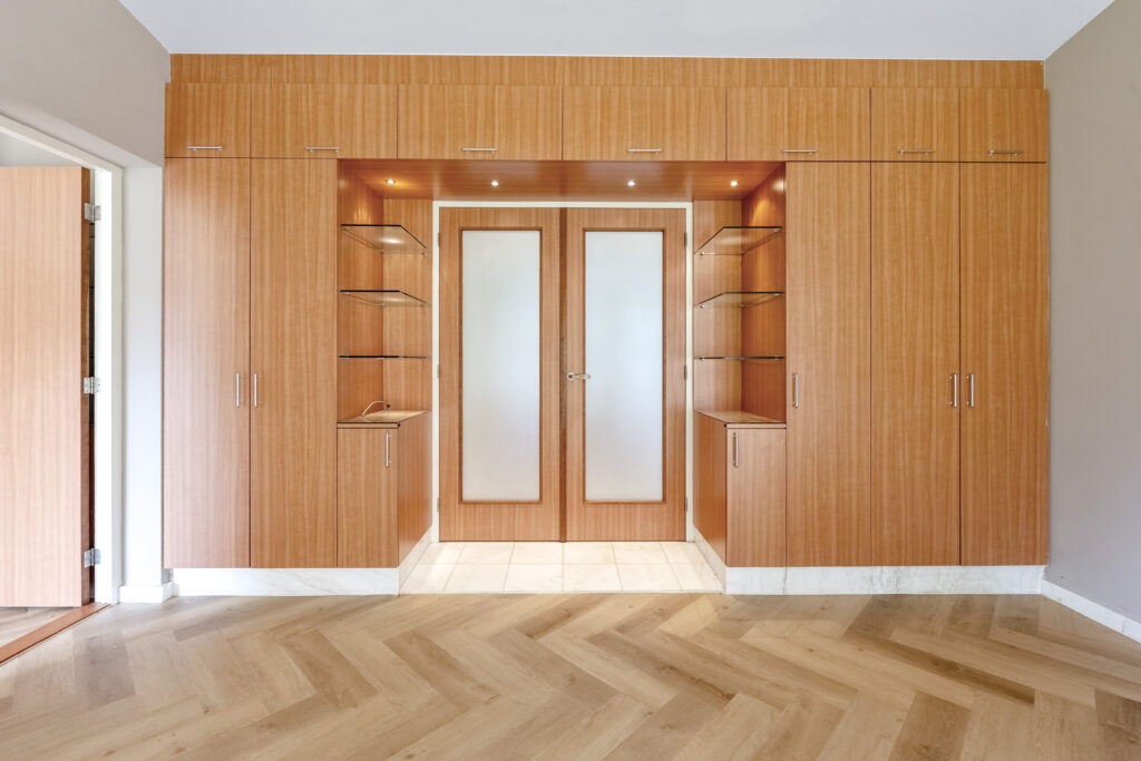 Modern wooden wardrobe with sliding doors