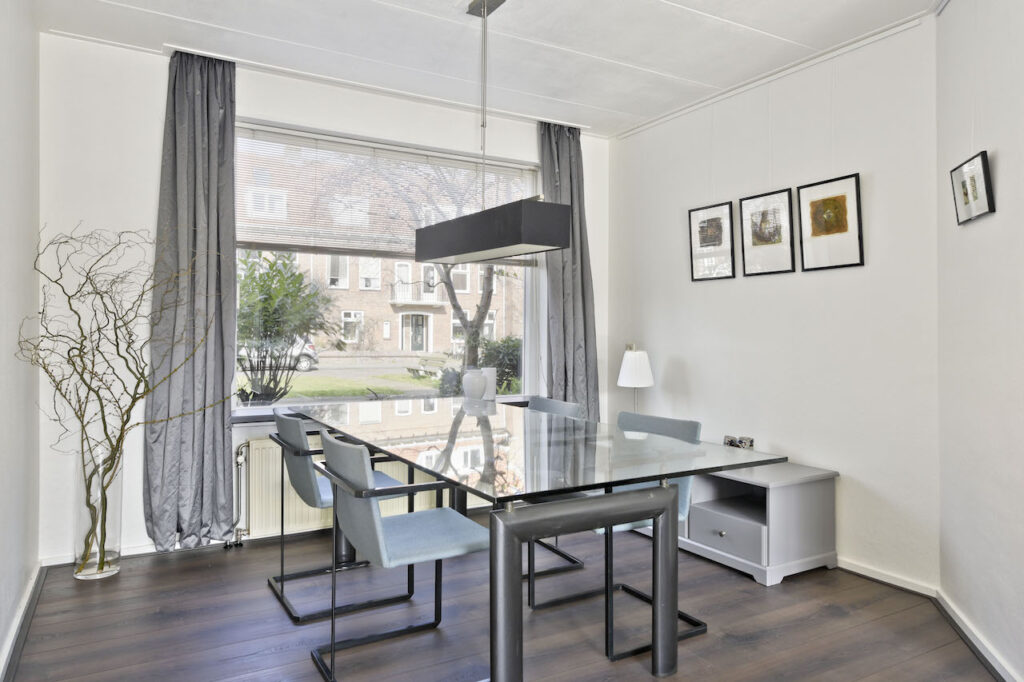 Modern dining room with glass table and chairs
