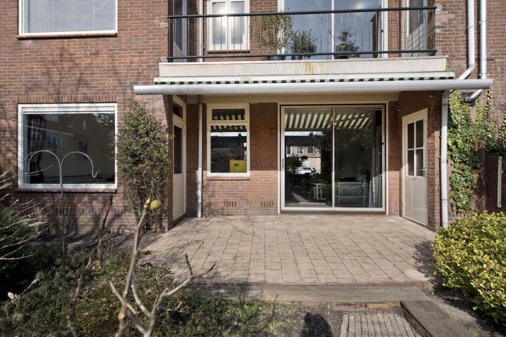 Brick house patio with sliding glass doors
