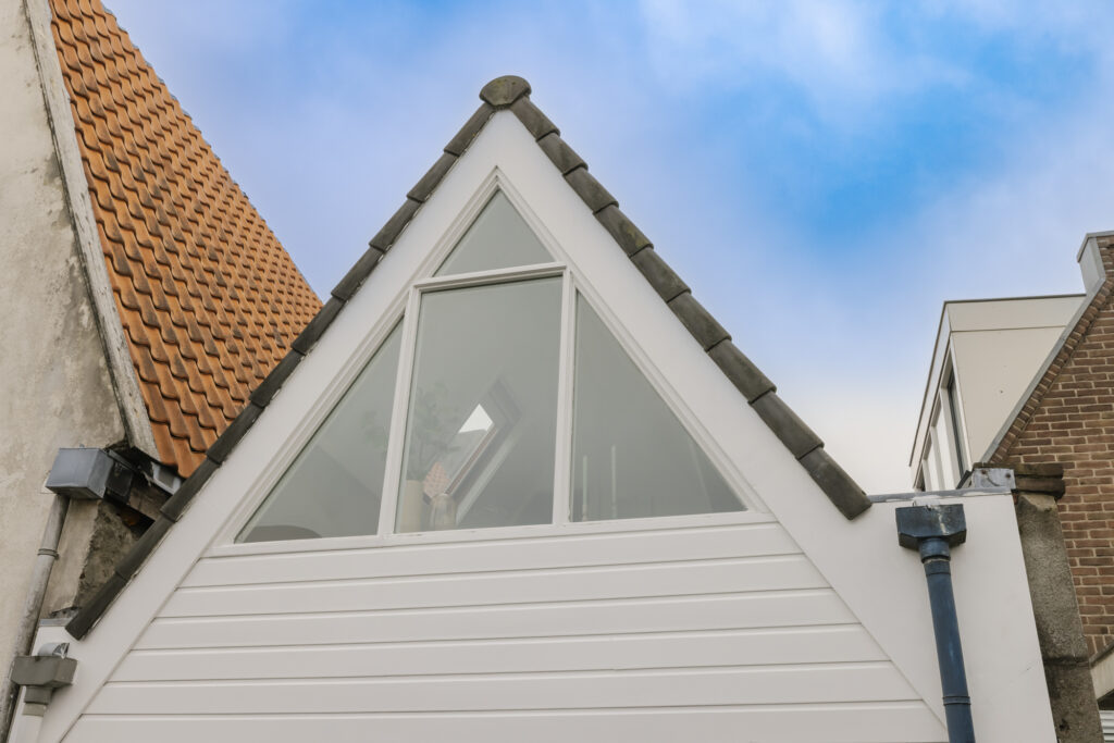 House with gable roof and triangular window
