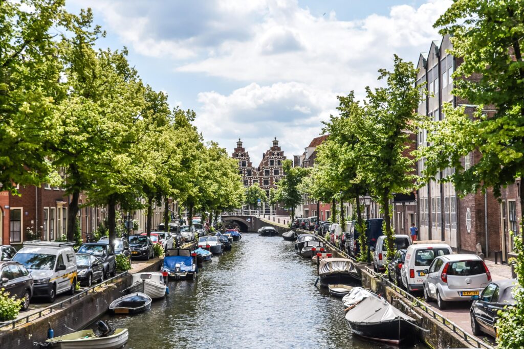 Amsterdam canal with boats and historic buildings