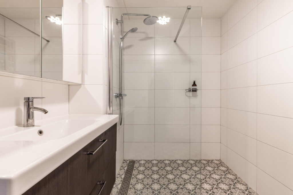 Modern bathroom with shower and patterned tiles