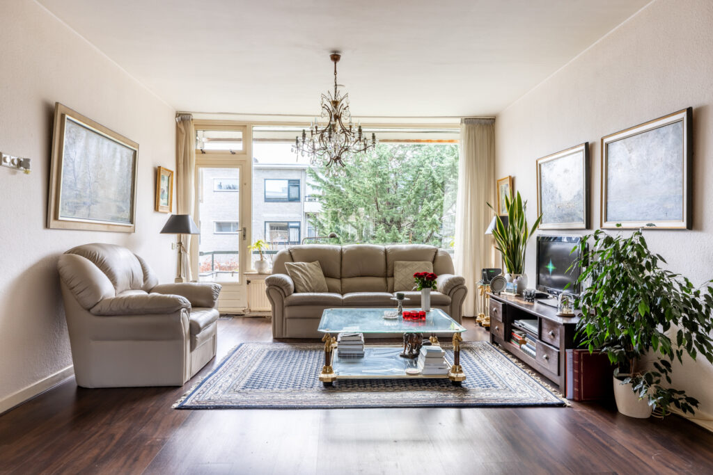 Cozy living room with leather sofas and decor.