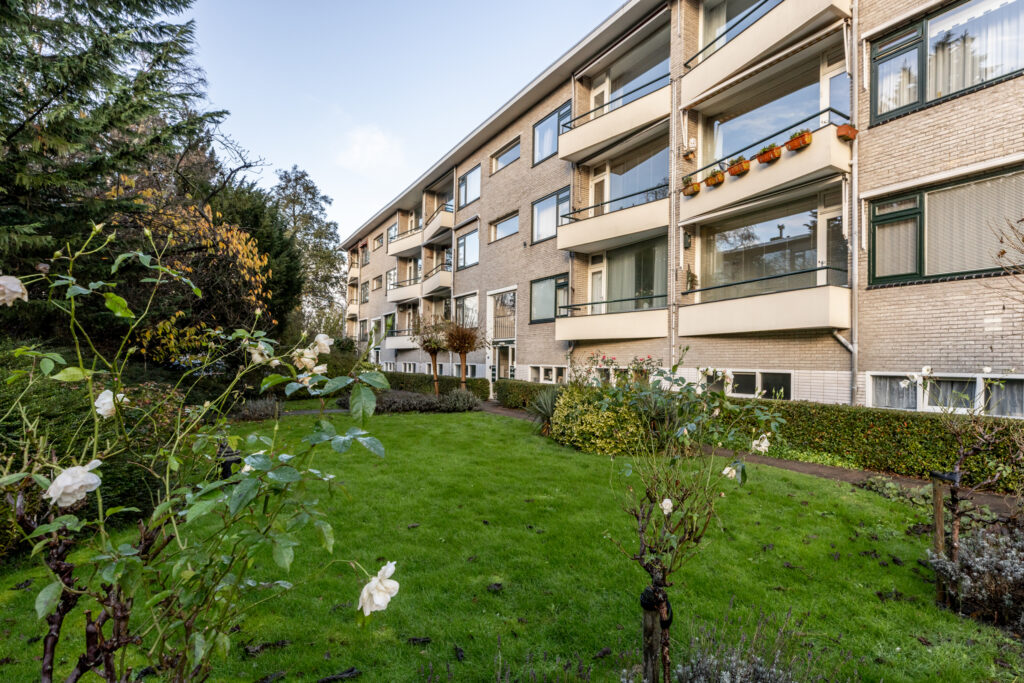 Exterior view of apartments with garden area.