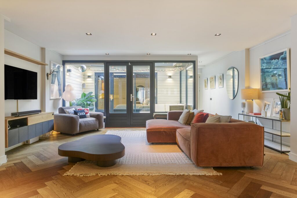 Modern living room with cozy seating and decor.