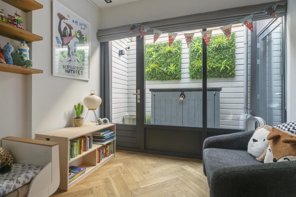 Modern child's room with bookshelves and indoor garden.