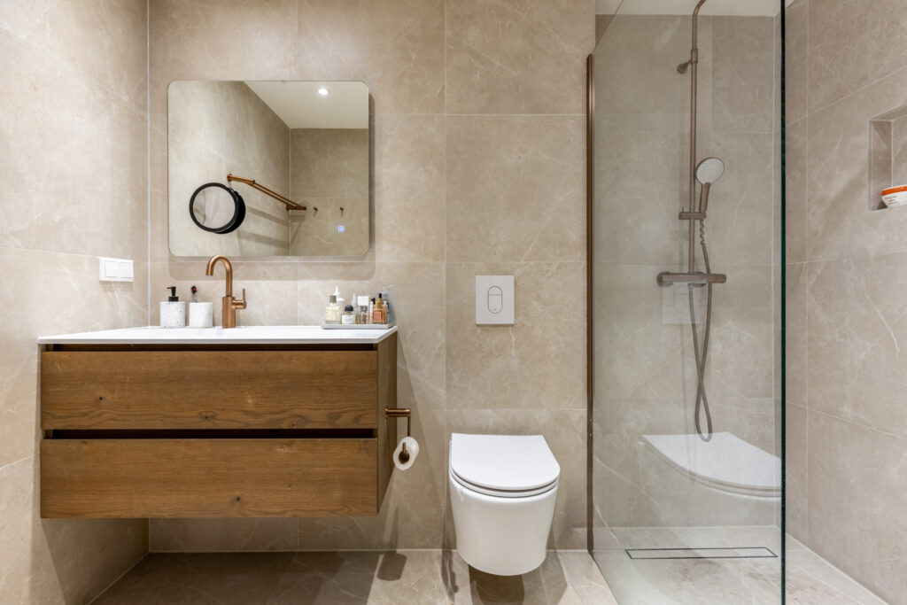 Modern minimalist bathroom with vanity and walk-in shower.