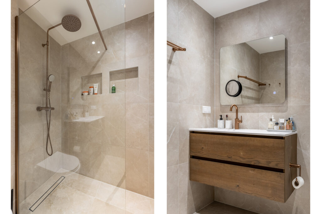 Modern bathroom with shower and wooden vanity.