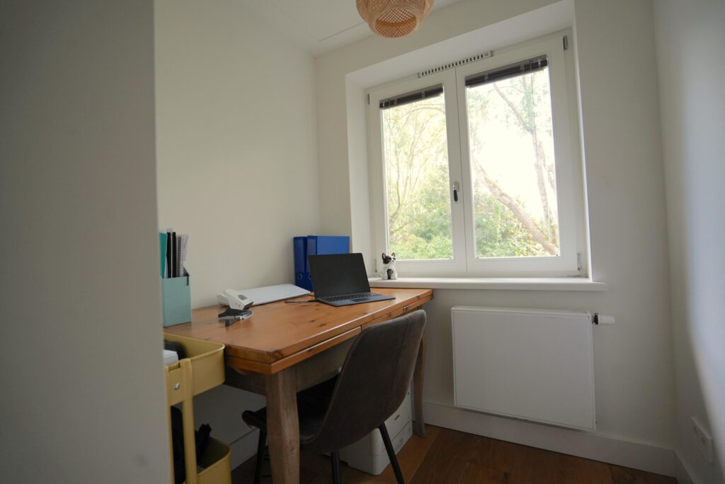 Cozy home office with window view.
